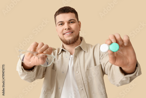 Young man with eyeglasses a...
