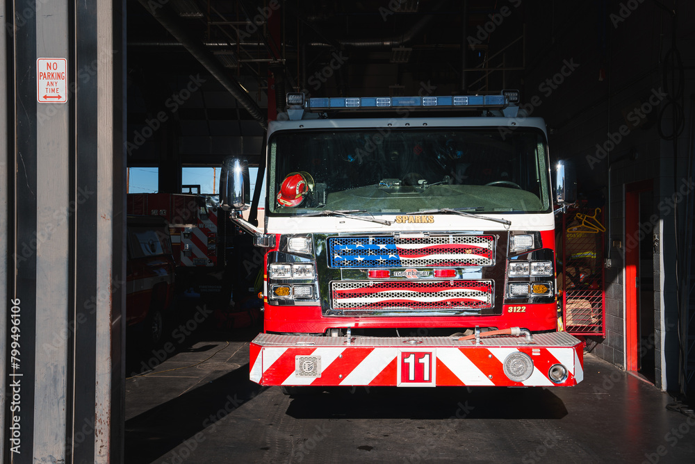 Fire station garage with red and white Chevrolet truck from Colorado at ...