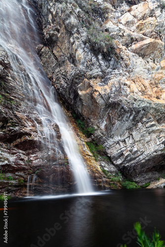 waterfall and stone in the forest in long exposure