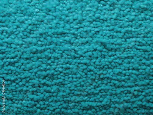 Turquoise close-up of monochrome carpet texture background from above. Texture tight weave carpet blank empty pattern with copy space for product 