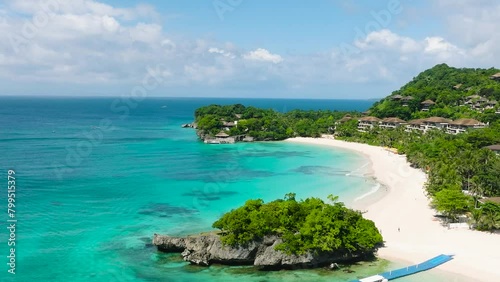 White sands with ocean waves and clear sea water in Punta Bunga Beach in Boracay, Philippines. photo