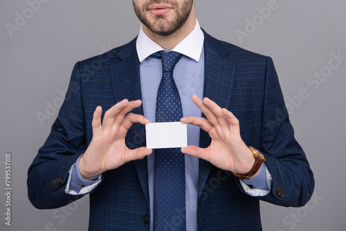 Businessman with credit card in studio. Business deal with emoney. Success of business. Businessman in suit hold credit card isolated on grey. Business branding. Pay the bill. Contact us © be free