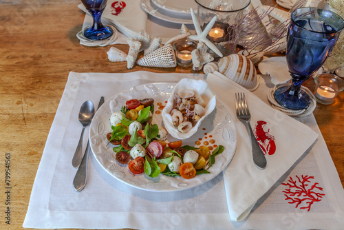 Seafood mix and Caprese salad with cherry tomatoes, mozzarella, basil, and arugula