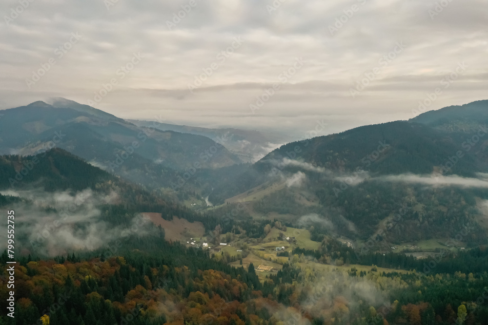 Obraz premium Aerial view of beautiful mountains on cloudy day