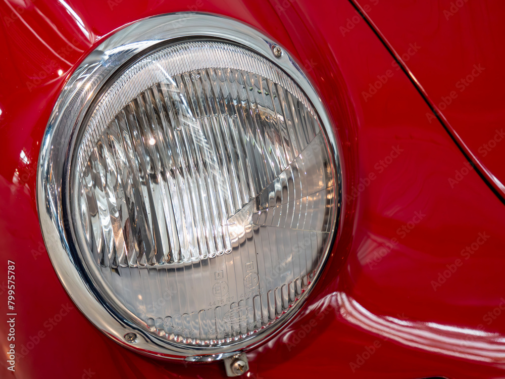 Classic Red Vintage Car Headlight Close-Up