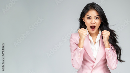 Malay Business Woman Celebrating Big Win, smile and raised hands