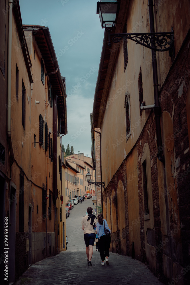 Couple walking at narrow streets of Florence