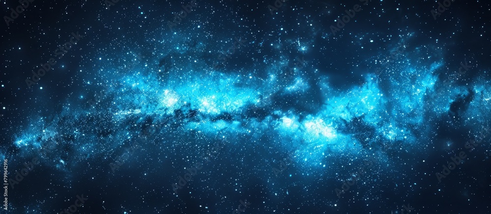 Fototapeta premium Vivid blue cosmic galaxy with twinkling stars against a deep black backdrop, creating a stunning celestial scene