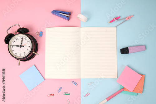 School supplies on blue and pink background with notes mockup