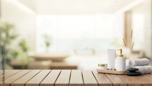 A spa shower set on a wooden table with a blurred background of a contemporary spacious bathroom.