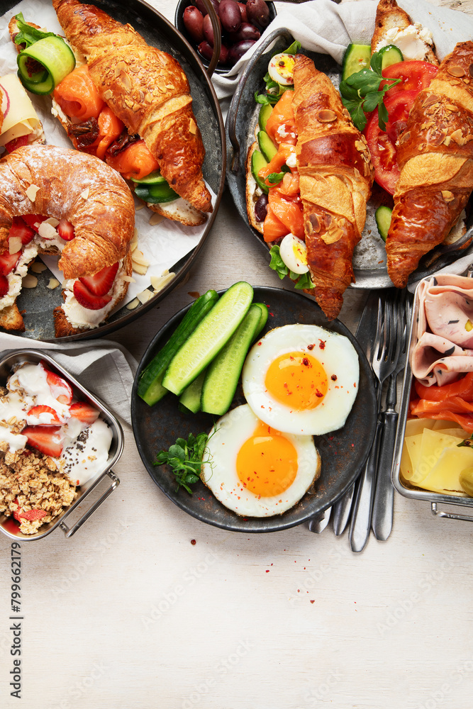 Large selection of breakfast food on a table. Large selection of breakfast food on a table.