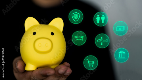 Hand holding a piggy bank and planning money icons. Concept of savings, investments, returns, interest, finance and banking. Value of growth in financial success. © Dontree
