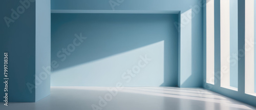 Minimalistic simple abstract light blue background for product presentation. Shadow and light from windows on wall.