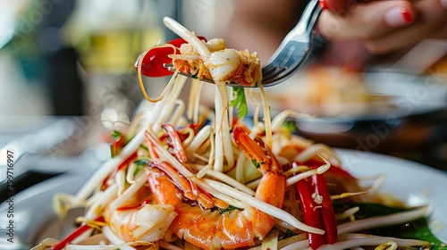 Close-up of a fork lifting a mouthful of som tam with crab, showcasing the texture and vibrant colors of this beloved Thai dish. photo