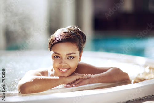 Portrait  woman and smile at spa  jacuzzi and relax on holiday  resort and hotel. African american  calm and happy in swimming  wellness and luxury on vacation  summer and tourist or getaway  face