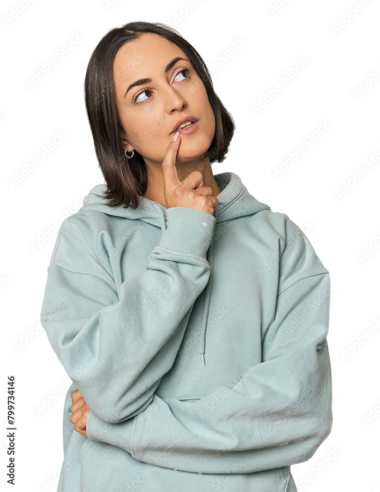 Young Caucasian woman with short hair looking sideways with doubtful and skeptical expression. Young Caucasian woman with short hair looking sideways with doubtful and skeptical expression.