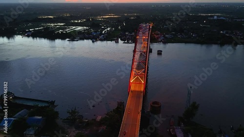 Rumpiang Bridge in the night, a bridge that stretches over the Barito river, Marabahan city, Barito Kuala district, South Kalimantan photo