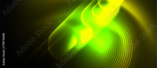A macro photograph showcasing a vibrant green and yellow circle of light against a black background. The pattern resembles a terrestrial plant, creating an artistic display in the darkness