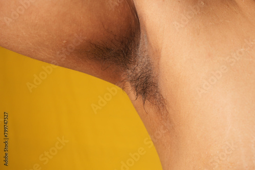 unshaved hairy man armpit, a lot of hair on the armpit. photo