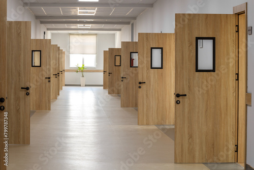 School corridor with open classroom doors, empty corridor on lockdown.