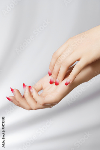 Beautiful woman s hands on light background. Care about hand. Tender palm with natural manicure  clean skin. Light pink nails