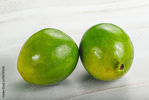 Fototapeta Naklejka Na Ścianę i Meble -  Two ripe green exotic avocado fruit