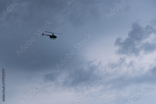 Solo Helicopter in Cloudy Sky