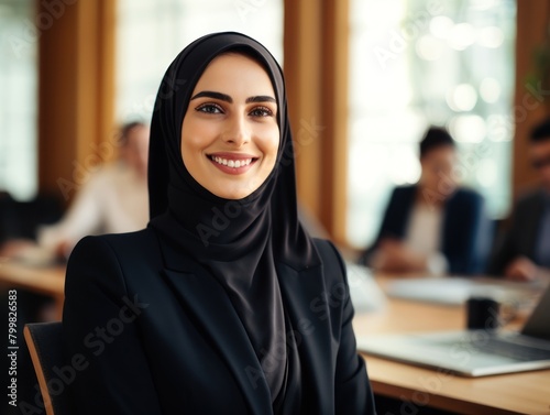 Smiling woman in black hijab © Balaraw