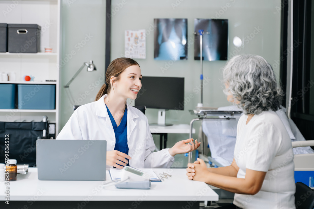 Portrait of female doctor explaining diagnosis to her patient. Doctor Meeting With Patient In Exam Room. A medical practitioner reassuring a patient . Portrait of female doctor explaining diagnosis to her patient. Doctor Meeting With Patient In Exam Room. A medical practitioner reassuring a patient .