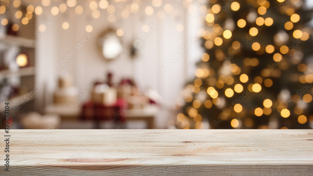 Empty wooden table over defocused christmas background with copy space