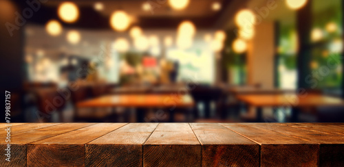 Empty wooden table for product placement or montage with focus to the table top, blurred bokeh background . photo
