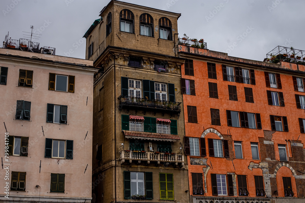 Fototapeta premium Colorful traditional houses in the harbor of the Old Town of Genoa, Architecture of the city of Genoa, Liguria, Italy 