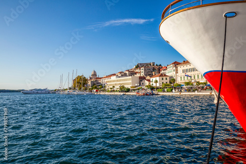 Croatia, Sibenik-Knin County, Sibenik, Bow of moored ship with marina in background photo