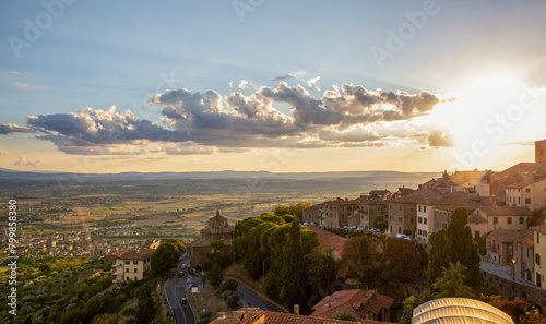 Italy, Province of Arezzo, Cortona, View of town overlooking Chiana Valley at sunset photo