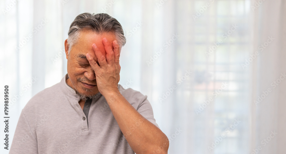 Sick unhappy senior elderly man touching head serious depressed feeling headache thinking of problem, alzheimer, cancer, stroke, parkinson, disease and cerebral haemorrage Sick unhappy senior elderly man touching head serious depressed feeling headache thinking of problem, alzheimer, cancer, stroke, parkinson, disease and cerebral haemorrage