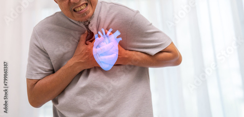 Senior asian adult elderly man with chest pain suffering from heart attack, health and medical, heart health, heart attack, world heart day, cardiovascular disease.insurance and hospital concept