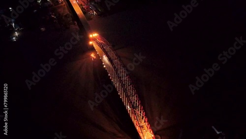 Rumpiang Bridge in the night, a bridge that stretches over the Barito river, Marabahan city, Barito Kuala district, South Kalimantan photo