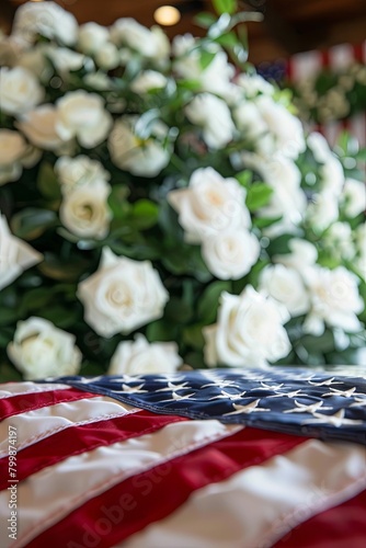 Closeup of American flag on coffin with white roses. Commercial funeral concept
