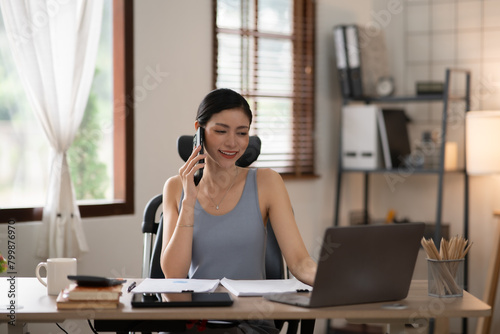 Asian woman doing activities, reading books, shopping online order through the internet at home or in the office during the holidays