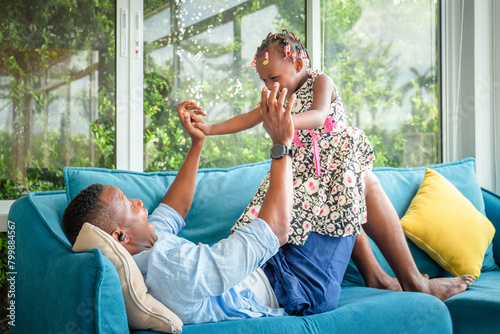 Father and daughter playing in the living room, Happy family concepts
