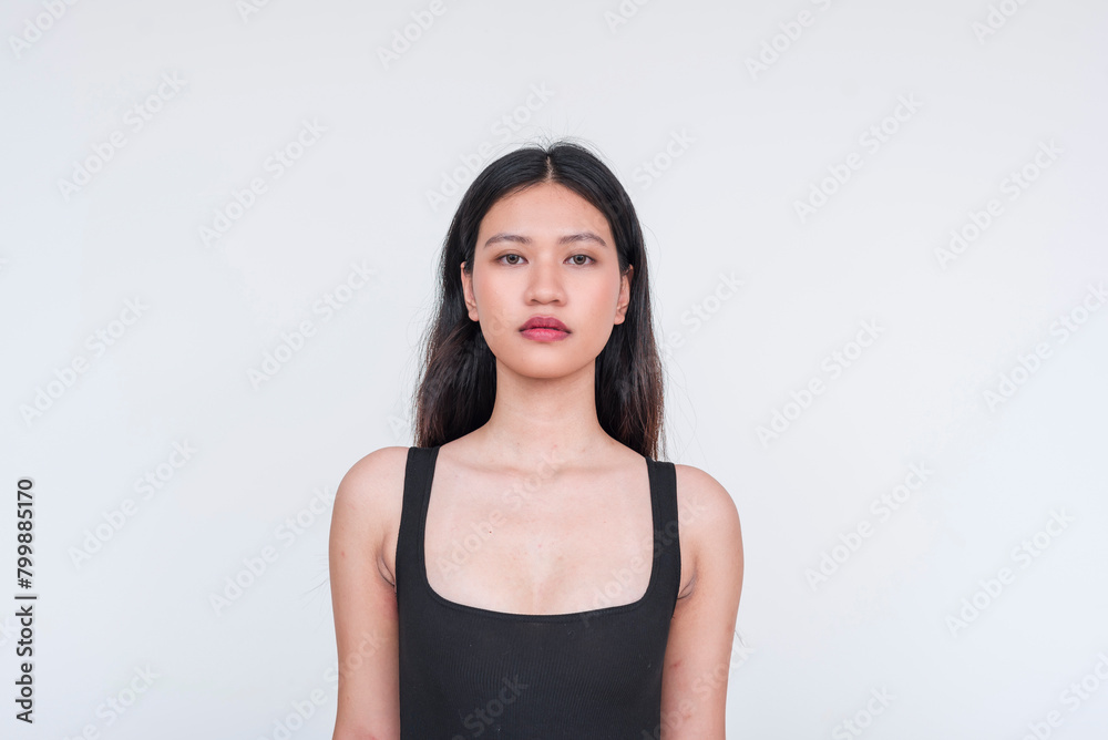Young Asian woman in a black bodysuit posing gracefully, isolated on white Young Asian woman in a black bodysuit posing gracefully, isolated on white