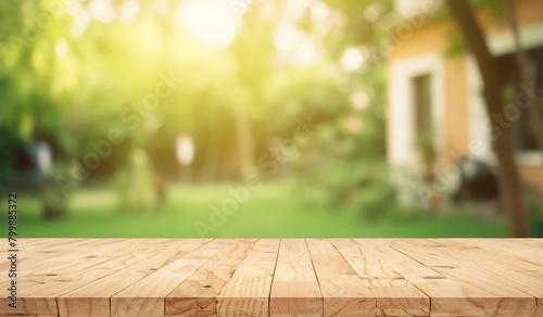 wooden table space with green home backyard view blur background for advertising template