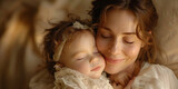 Portrait of a happy mom holding a sleeping infant in her arms. Loving mother and newborn baby
