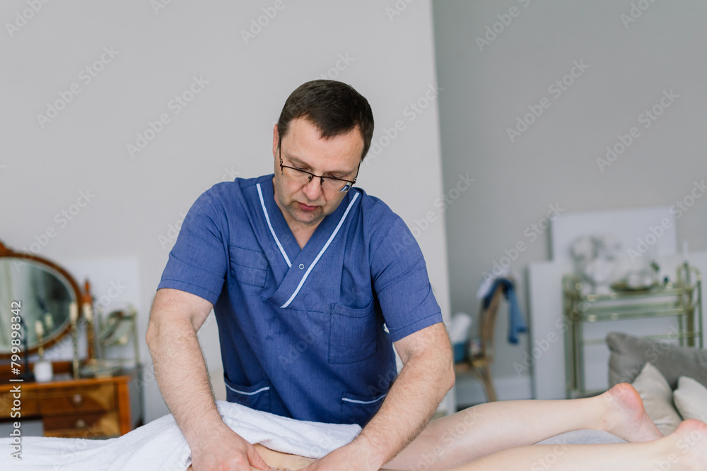 Young fat woman getting massage treatment in day spa cabinet. Young fat woman getting massage treatment in day spa cabinet.