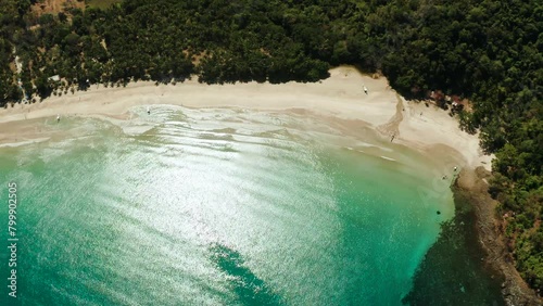 aerial view of tropical sandy beach in bay with blue water. Nagtabon. Palawan, Philippines. Seascape with sea, sand, palm trees. Summer and travel vacation concept photo