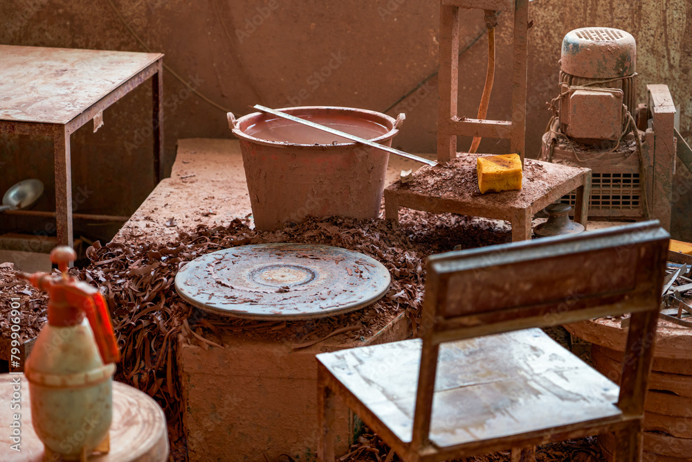 A craftsman makes porcelain in a traditional Chinese porcelain factory A craftsman makes porcelain in a traditional Chinese porcelain factory