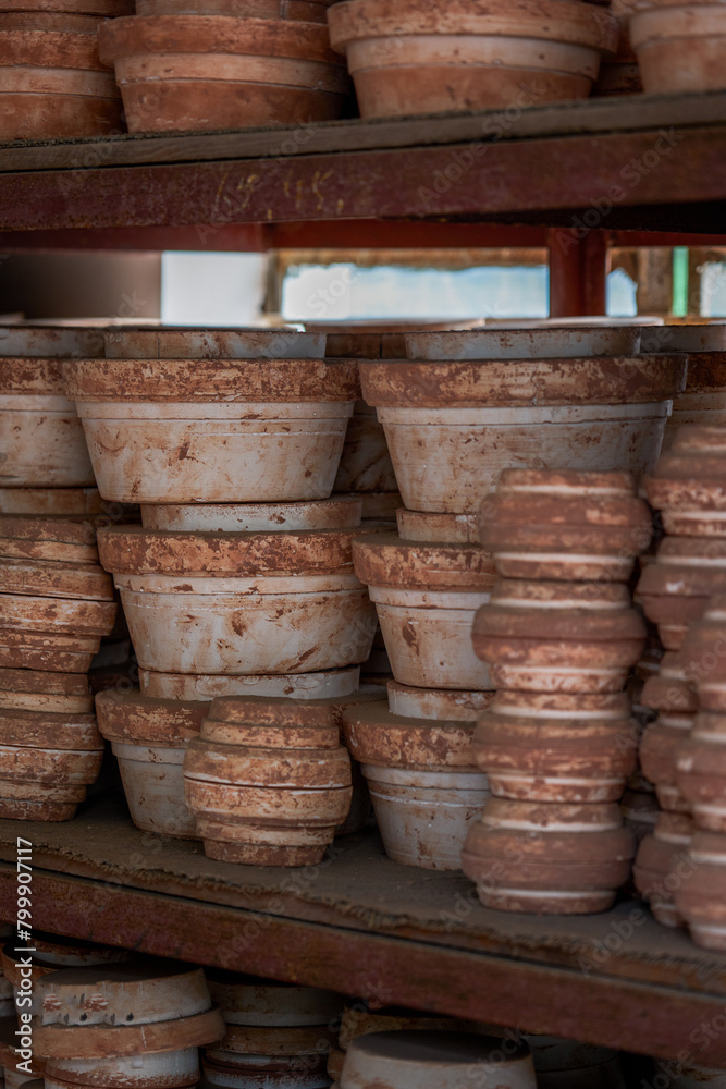 Neatly stacked clay embryos and molds in a traditional Chinese pottery factory Neatly stacked clay embryos and molds in a traditional Chinese pottery factory