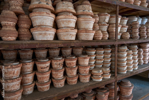 Neatly stacked clay embryos and molds in a traditional Chinese pottery factory © Steve