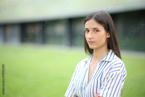 Serious woman looking at camera in a business center