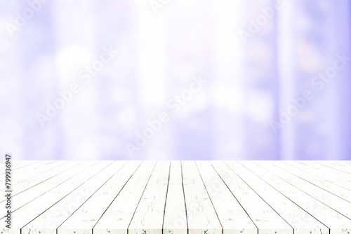 Perspective white wooden table on top over blur natural background, can be used mock up for montage products display or design layout.